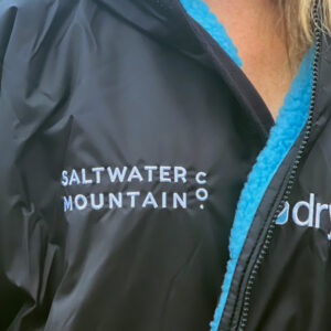 Amy wearing dryrobe close up of front side logo